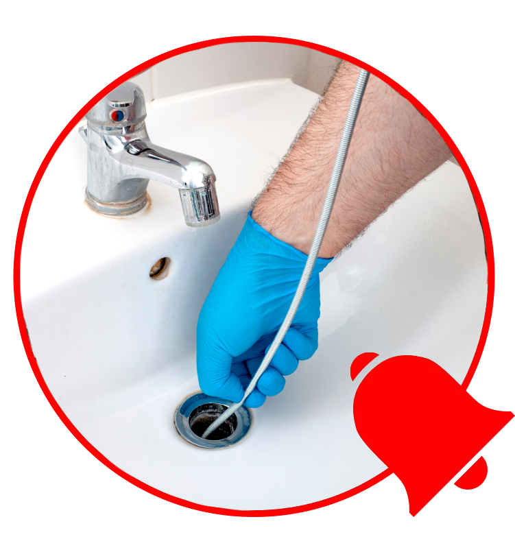 plumber cleaning clogged drain