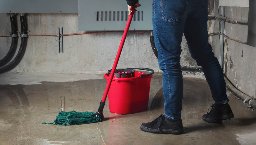 Backed-up sewer line, woman mopping floor Redwood City, CA