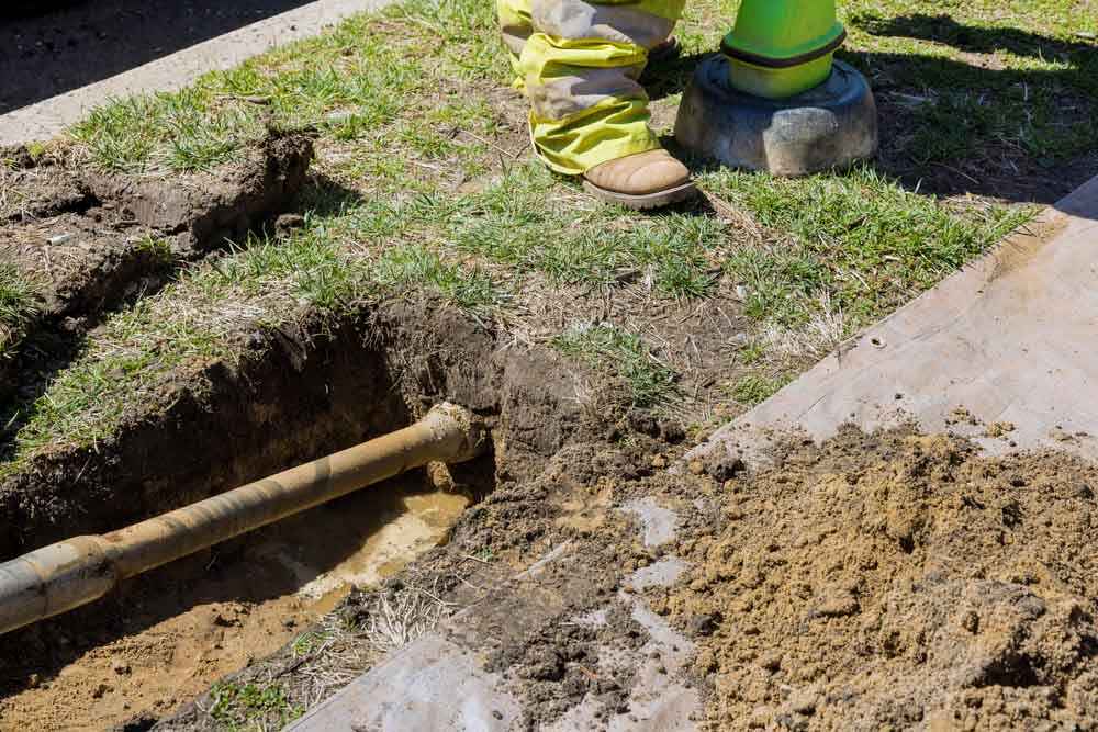 Bell Plumbing technician working on trenchless repairs